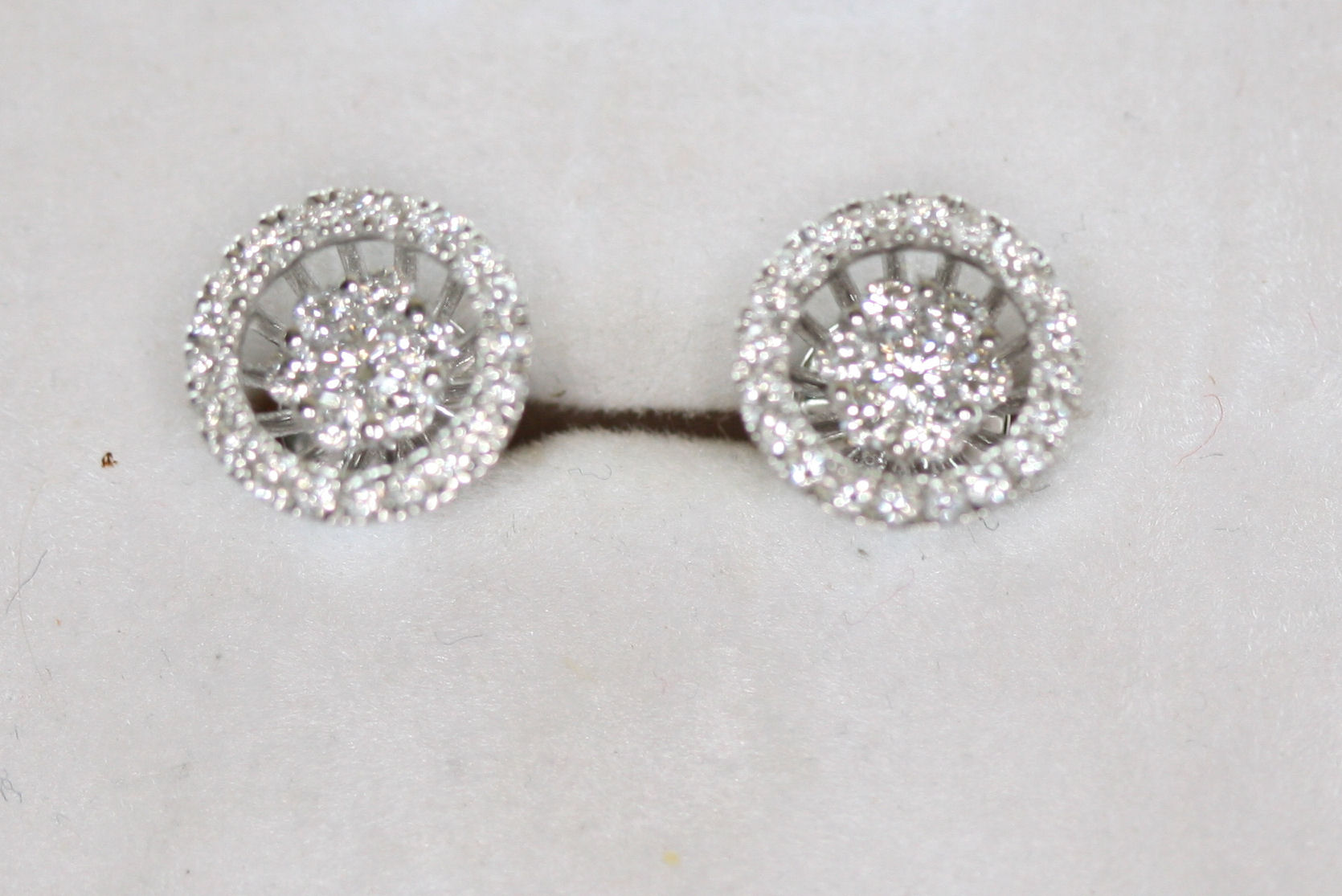A pair of diamond cluster earrings