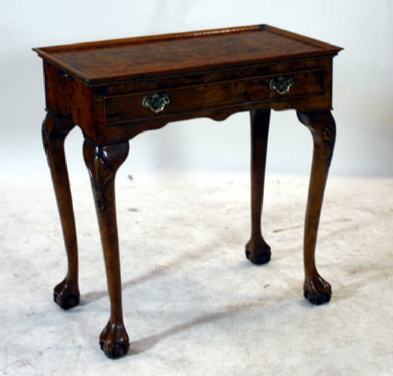 A Georgian style burr elm silver table
