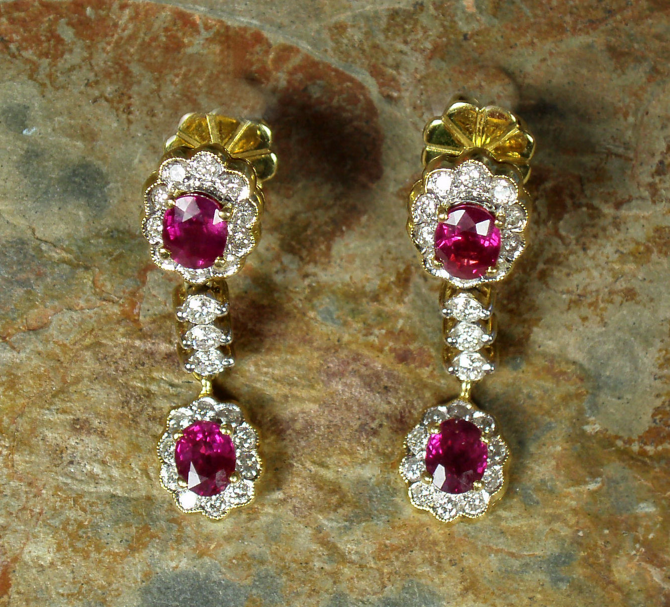 A pair of ruby and diamond pendant earrings,