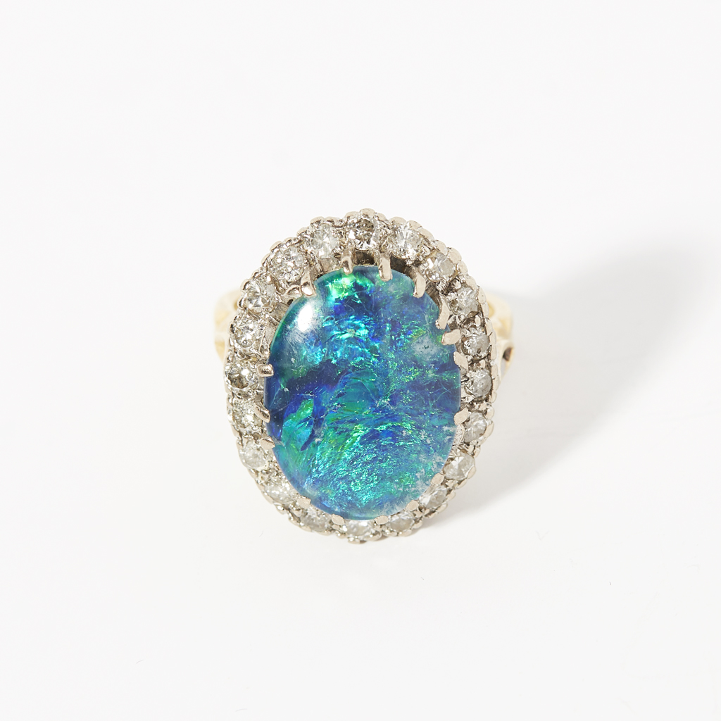 A black opal triplet and diamond set cluster ring