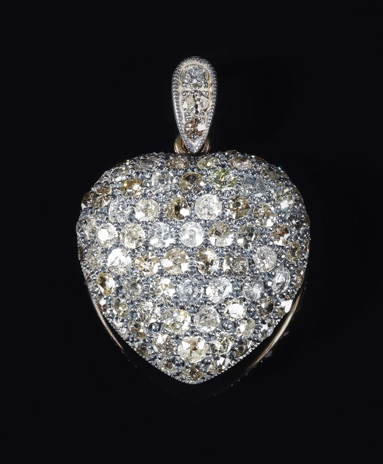 A Victorian style diamond set heart pendant