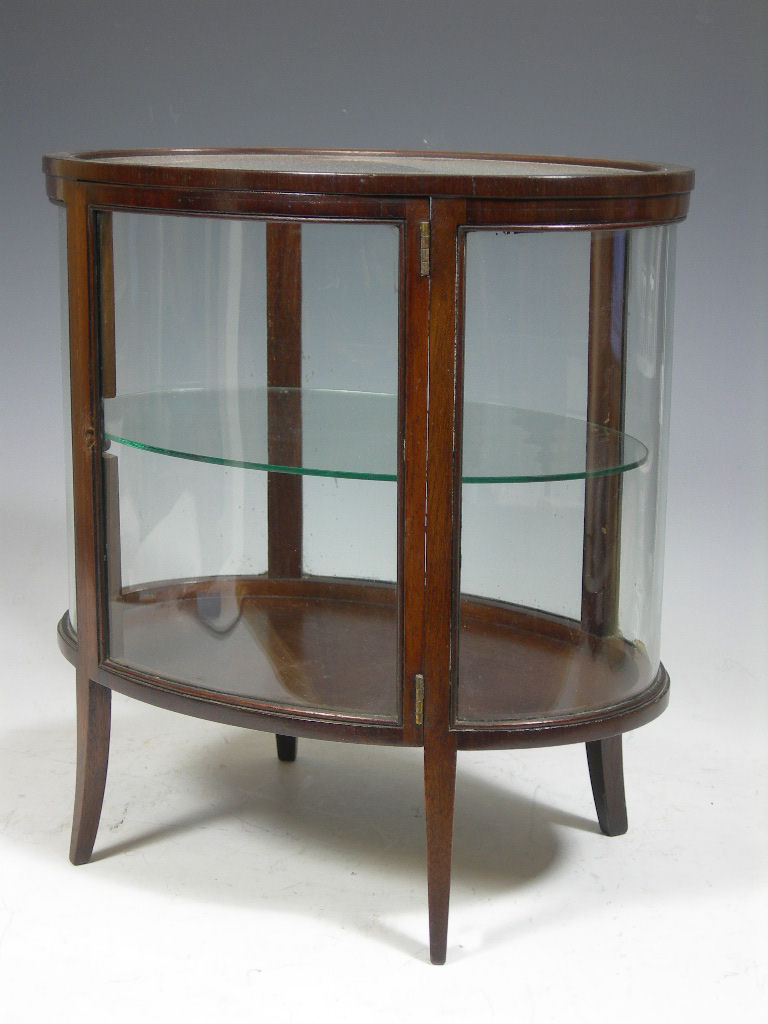 A table top mahogany display cabinet