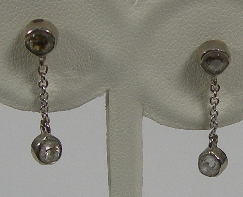 A pair of diamond pendant earrings,