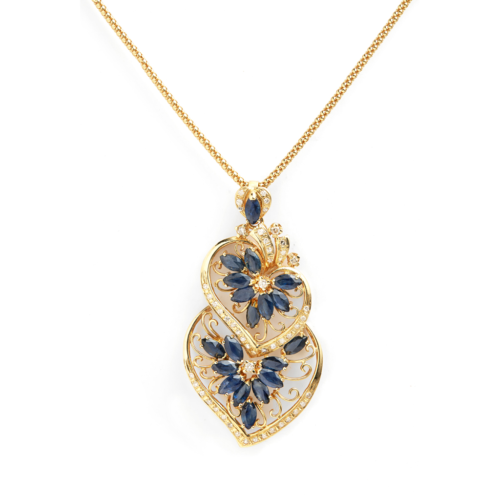 A sapphire and diamond set pendant