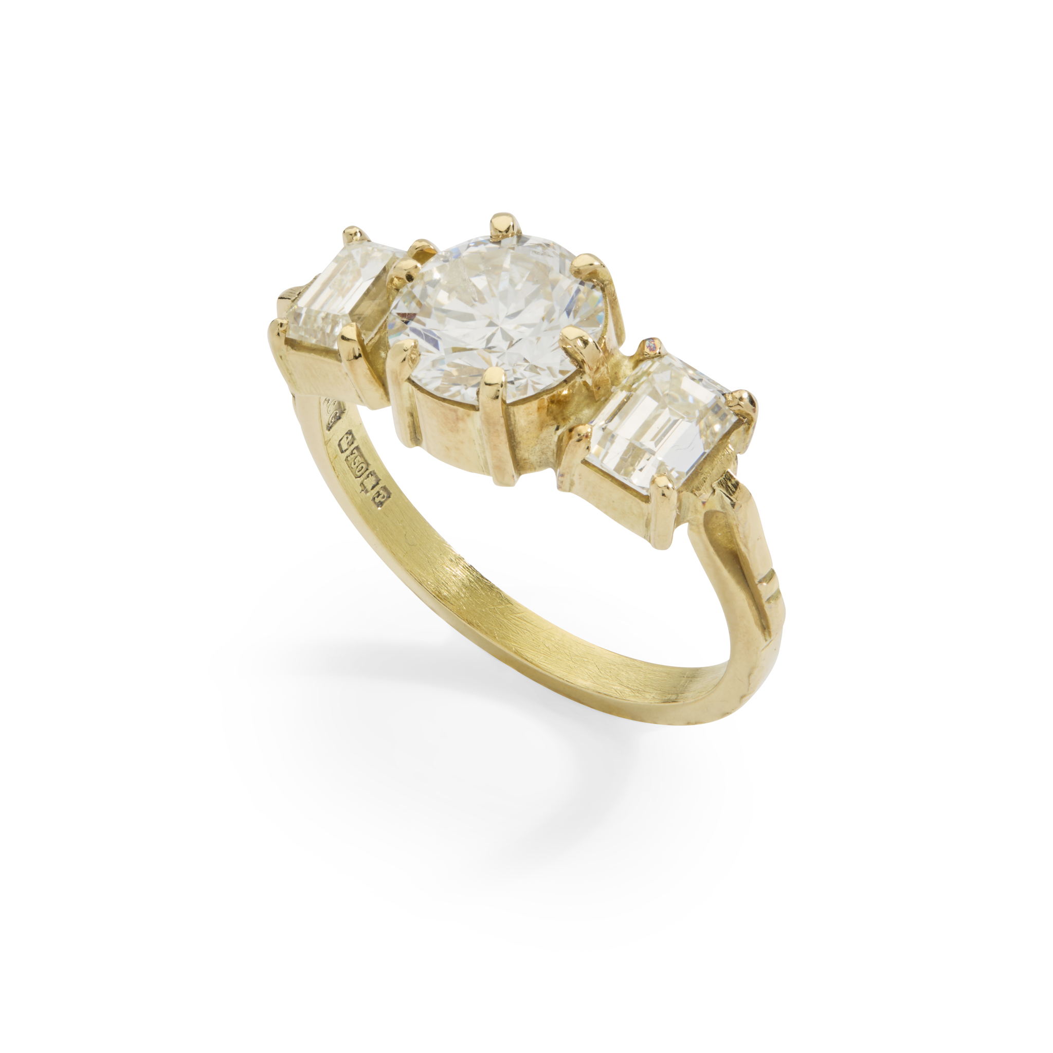 An 18ct gold diamond three-stone ring