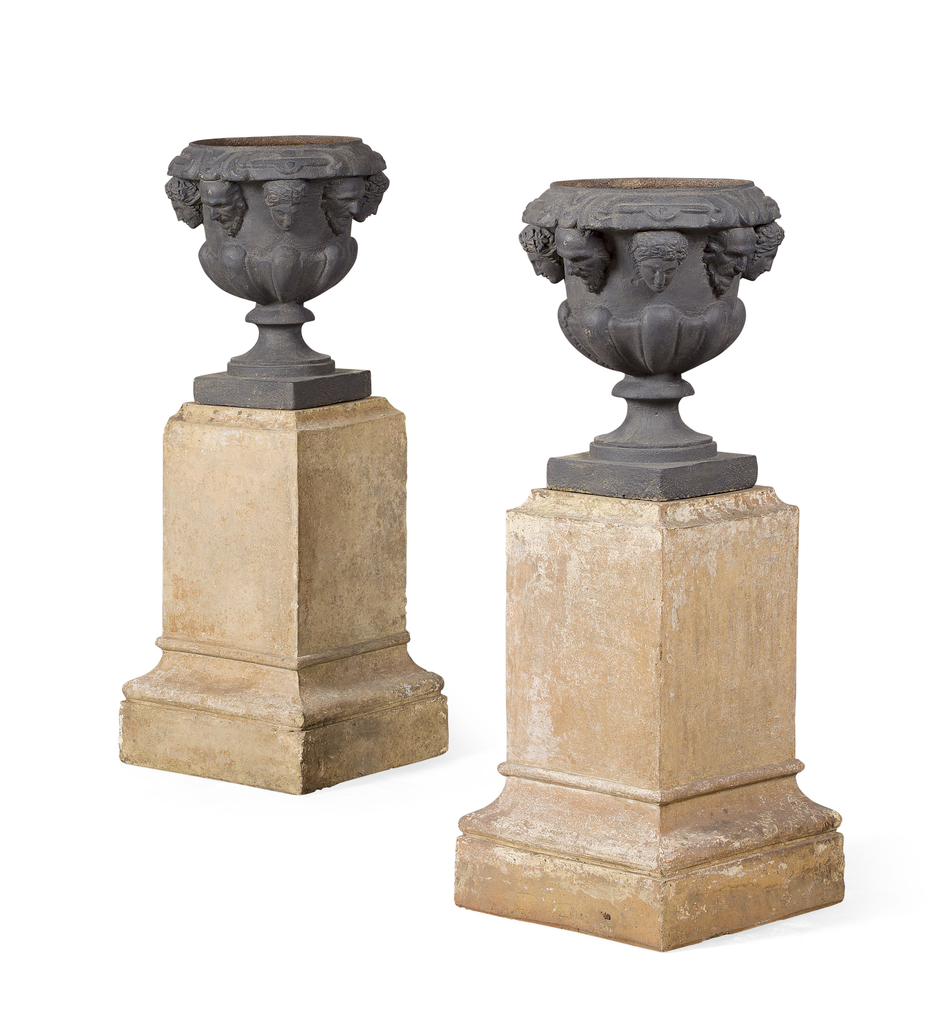 PAIR OF VICTORIAN CAST IRON GARDEN URNS ON FIRE-CLAY STANDS