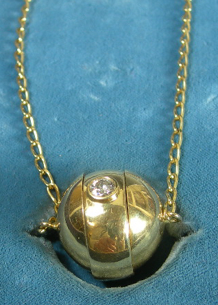 A French gold diamond set pendant/ring,