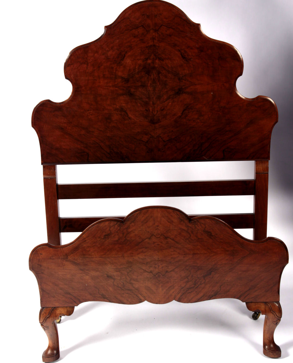 A pair of walnut single beds By Whytock and Reid