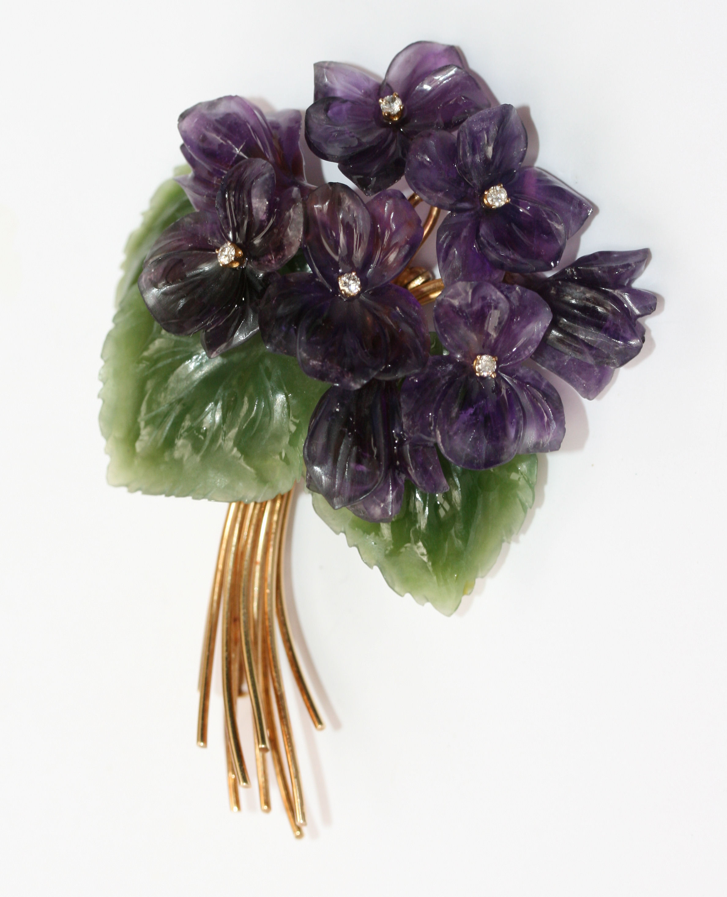 A multi-gem set foliate spray brooch