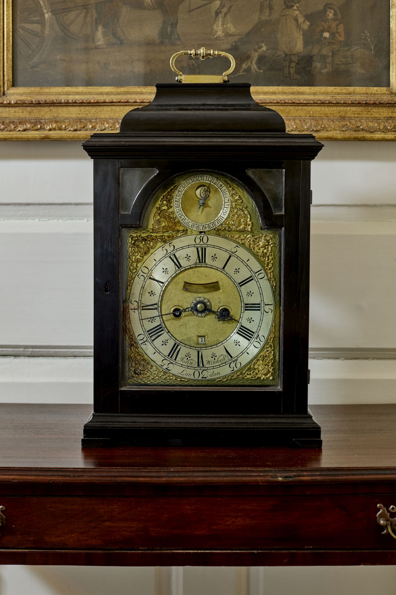 GEORGE II EBONY AND EBONISED BRACKET CLOCK WITH PENNY MOON, JOHN MITCHELL, LONDON