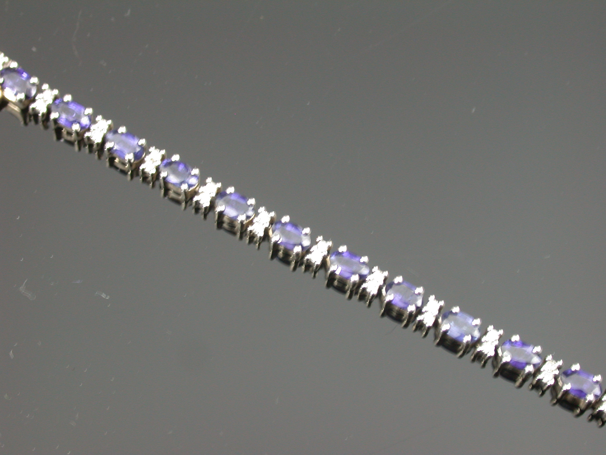 A 9ct gold mounted sapphire and diamond bracelet,