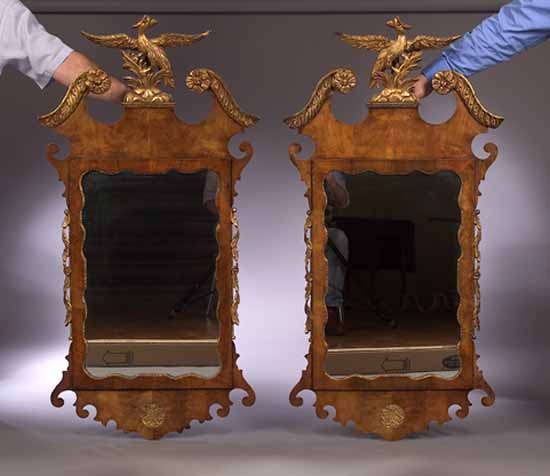 A pair of walnut and giltwood wall mirrors
