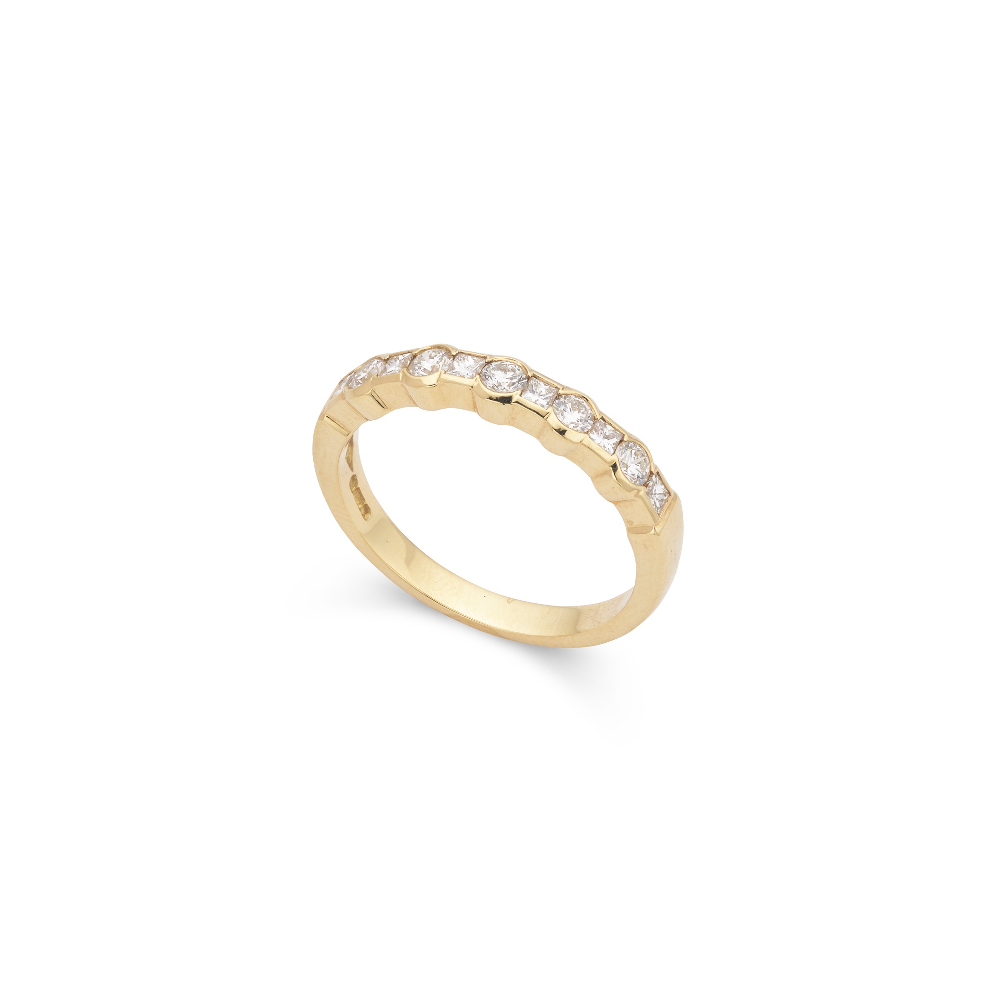 A diamond half-eternity ring in 18ct yellow gold