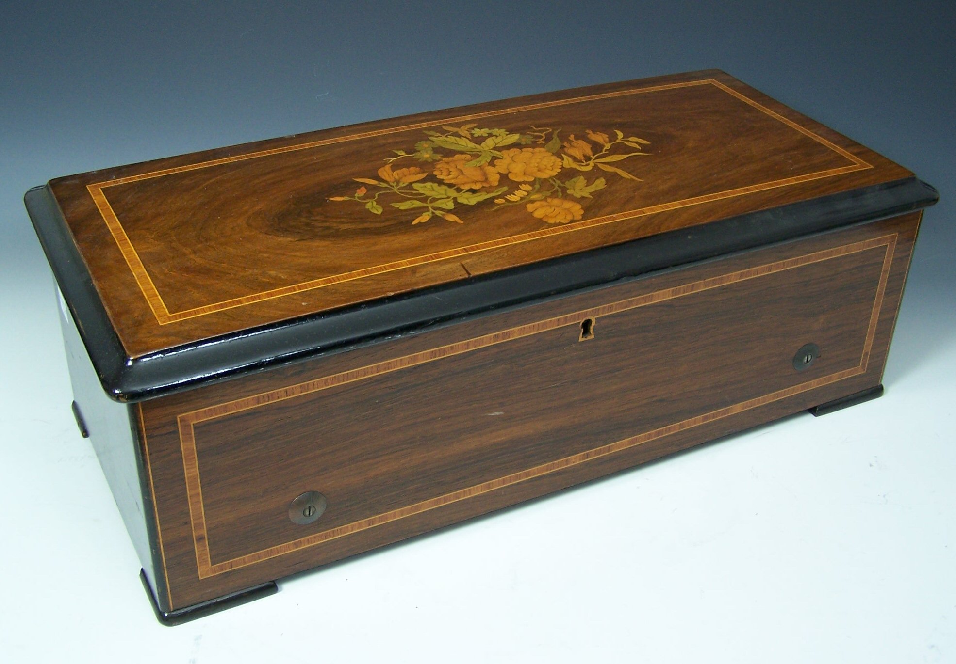 A late 19th century rosewood cased musical box By Nicole Freres
