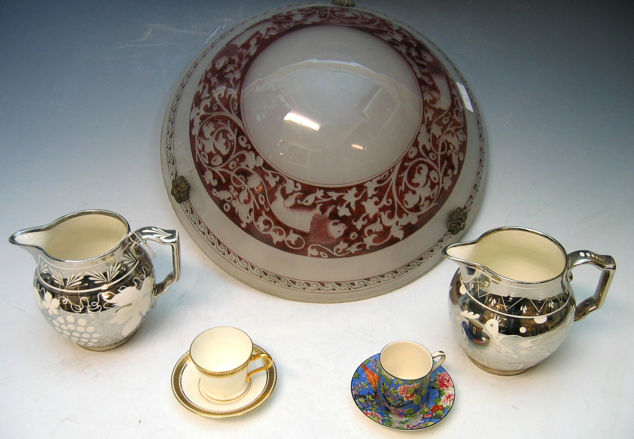 A pair of opaque glass domed lamp shades,