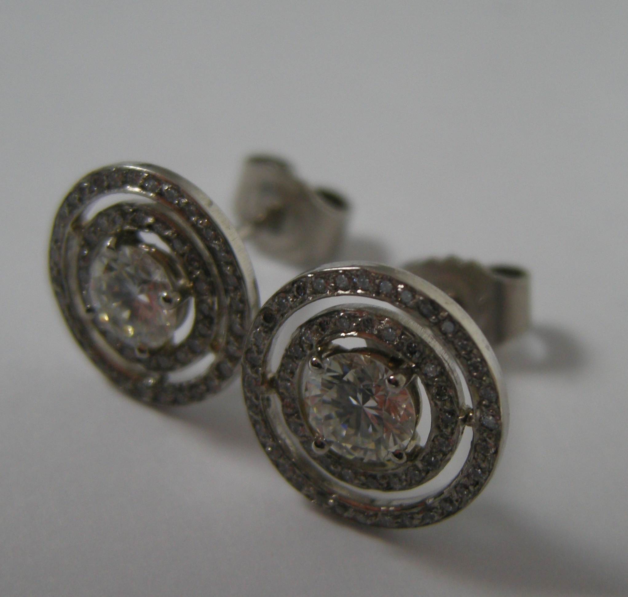 A pair of all diamond cluster earrings