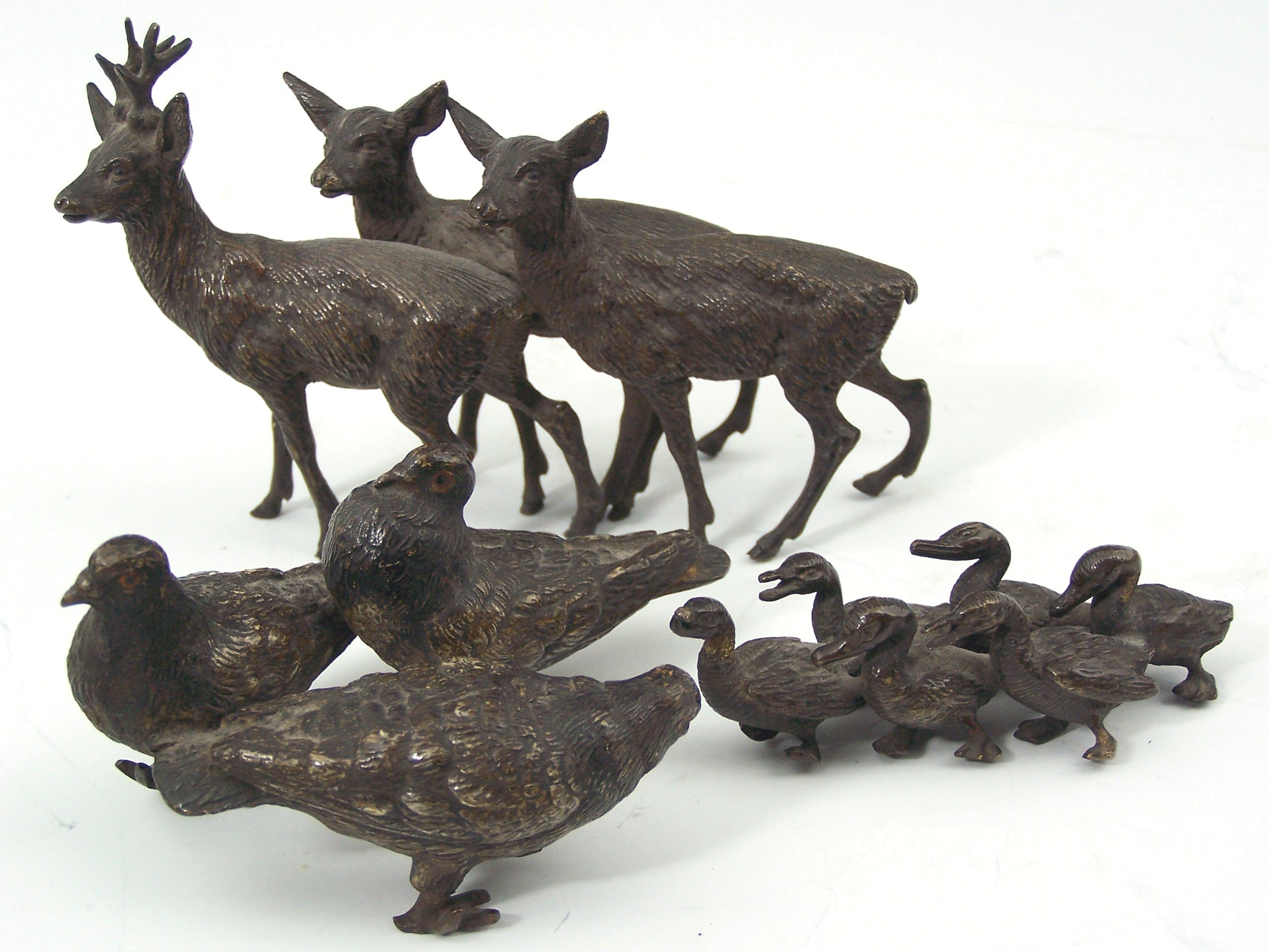 An Austrian cold painted bronze group of three standing deer,