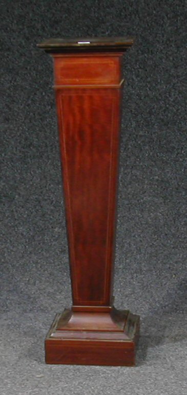 An Edwardian mahogany pedestal,