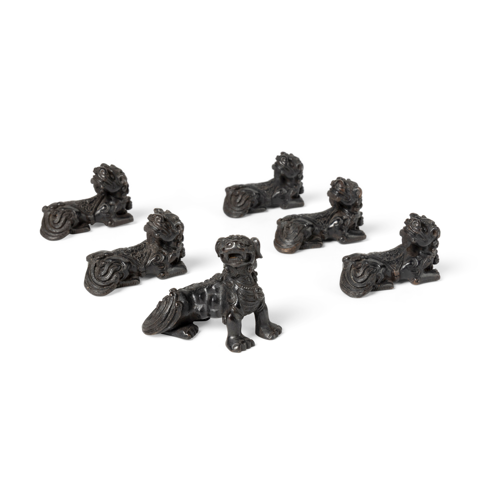 GROUP OF SIX CHINESE BRONZE BUDDHIST LION-DOG PAPERWEIGHTS