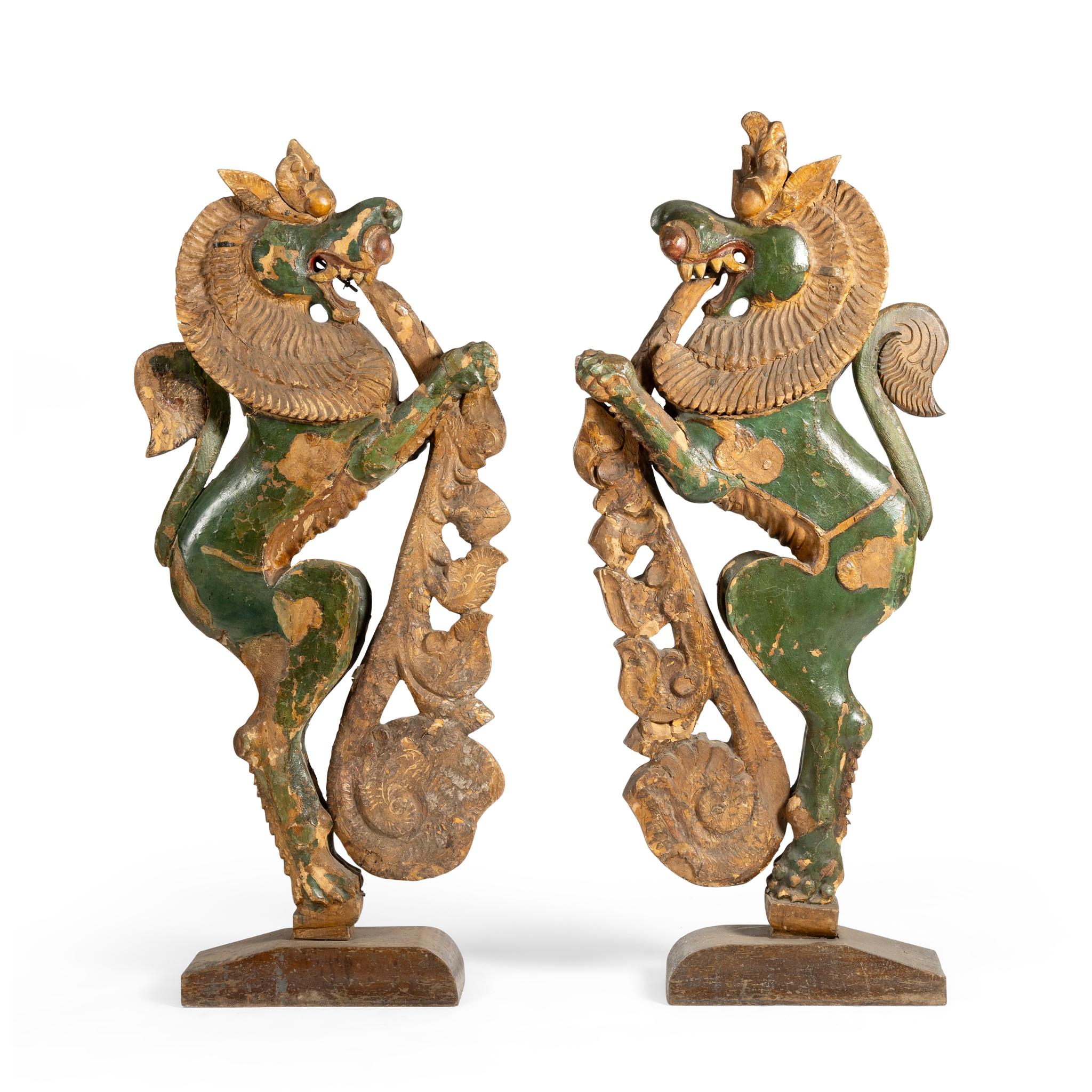 A PAIR OF CHINESE GREEN PAINTED AND GILT DECORATED ARCHITECTURAL ELEMENTS OF MYTHICAL BEASTS