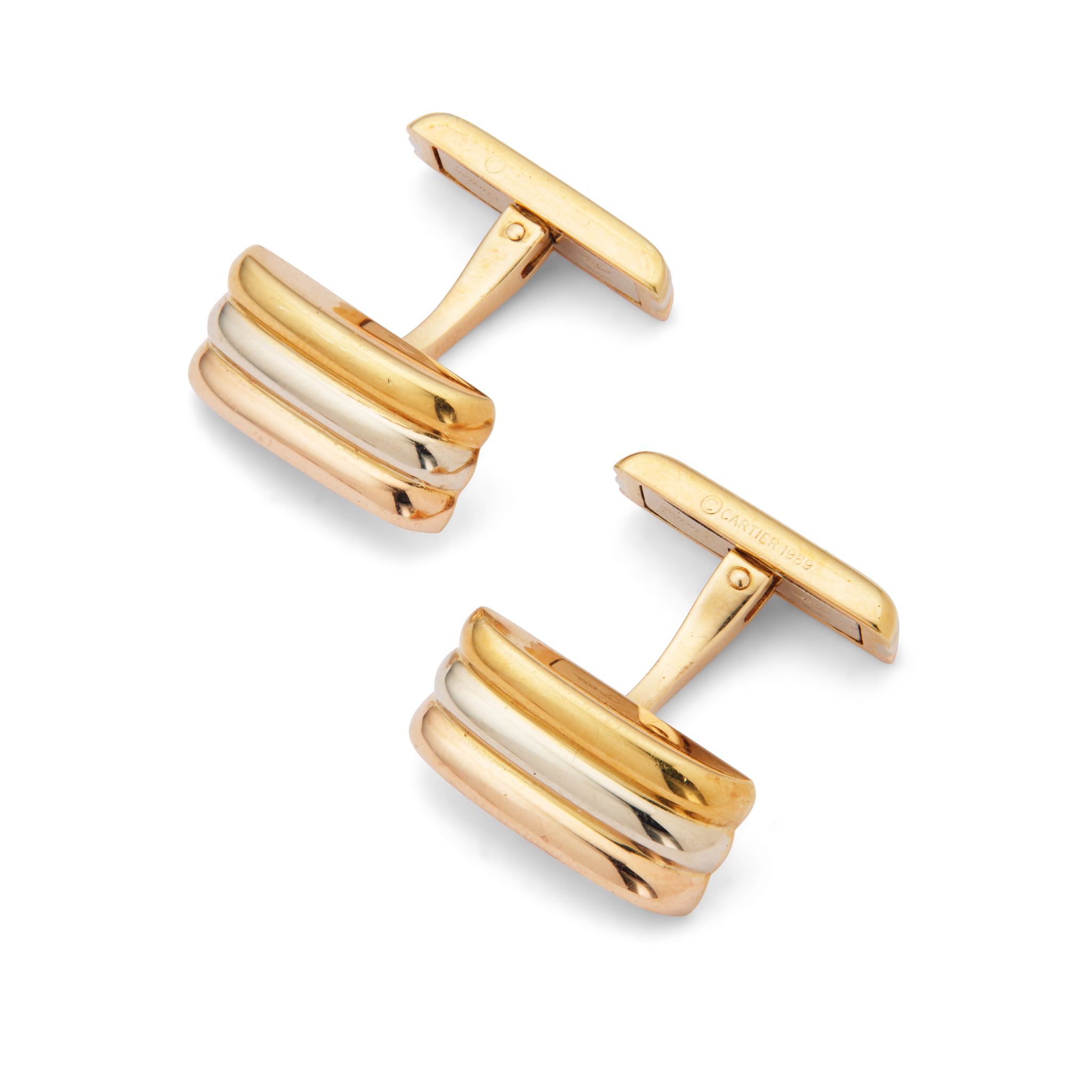 Cartier: A pair of tri-coloured cufflinks
