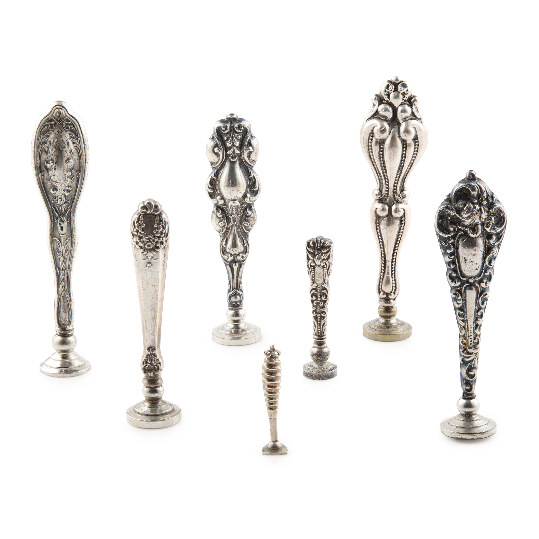 A COLLECTION OF SILVER AND PLATED SILVER SEALS