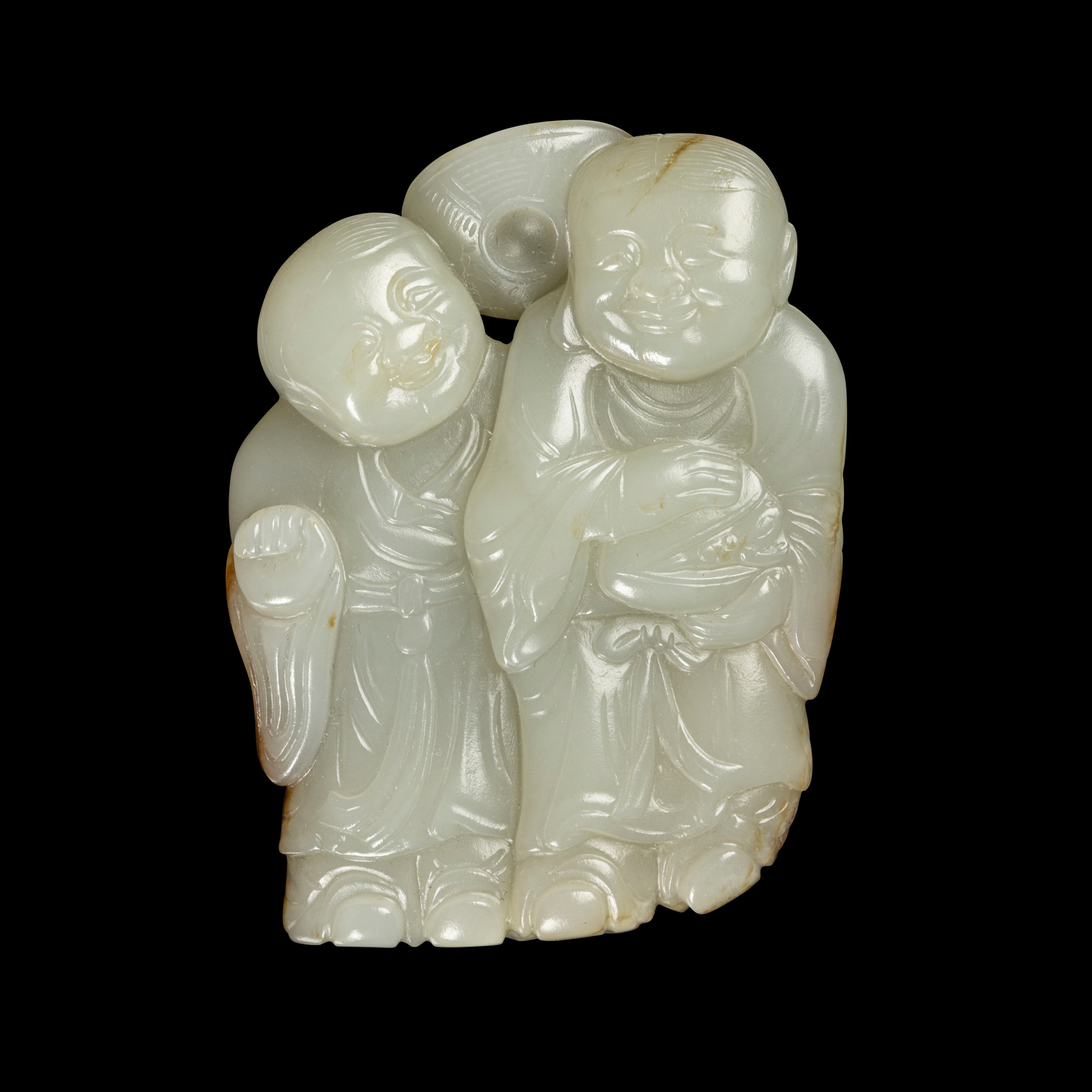 CELADON JADE WITH RUSSET SKIN CARVING OF 'HEHE ERXIAN' PENDANT