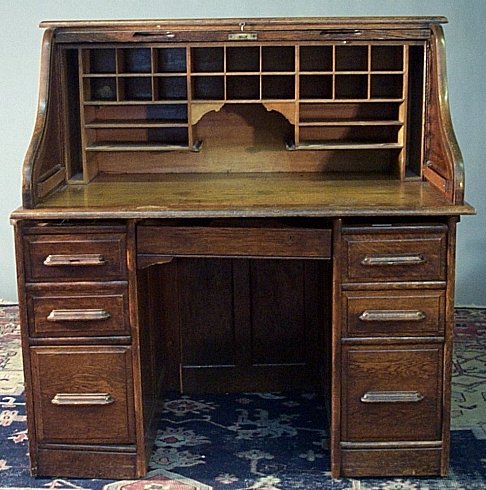 An oak roll top desk