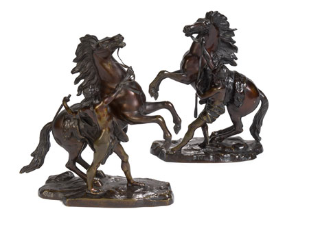 A pair of late 19th century bronze models of the Marly horses