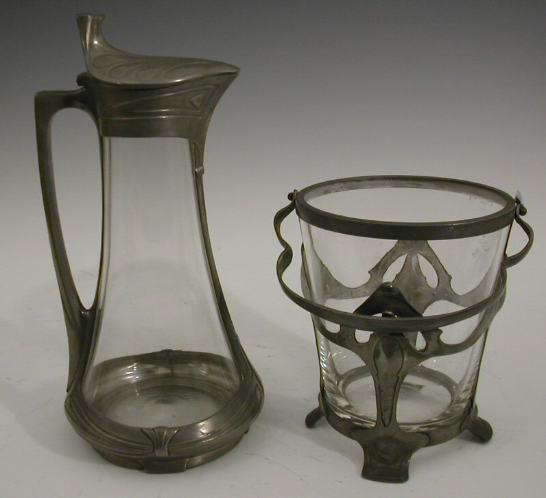 An Art Nouveau pewter mounted ice bucket,