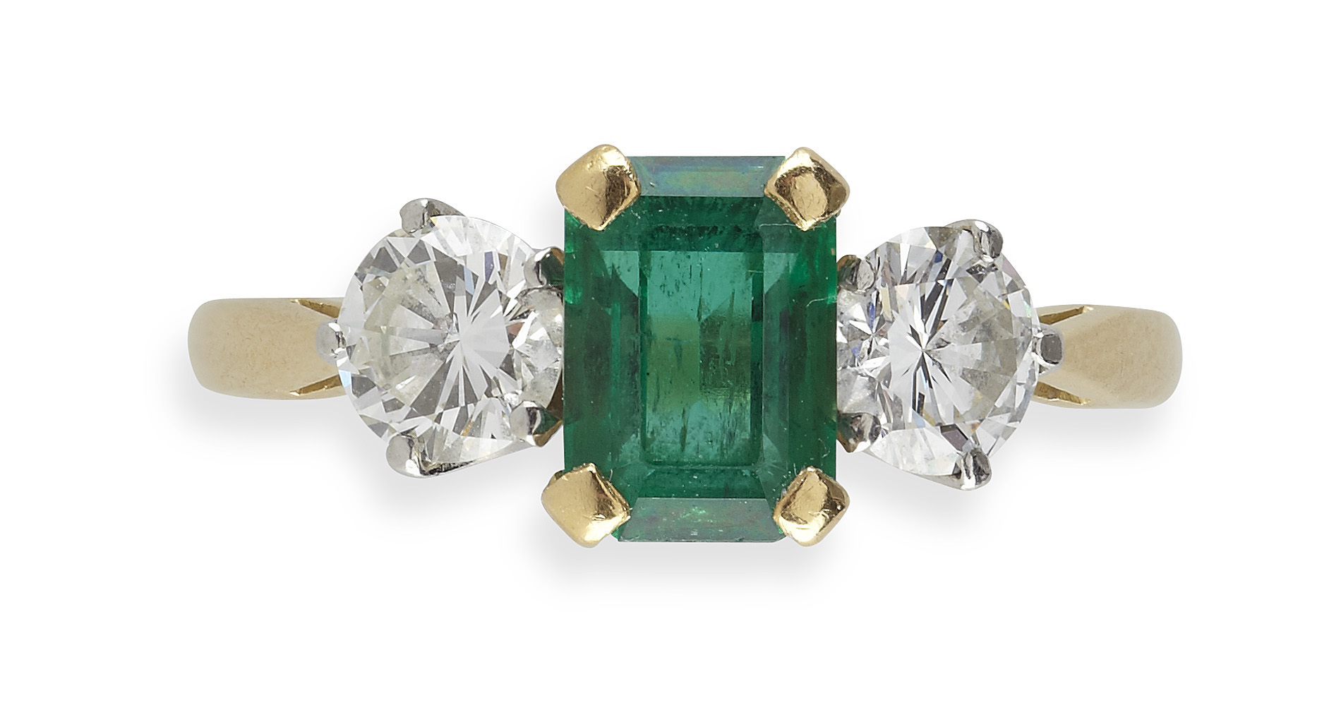 An 18ct gold mounted emerald and diamond set three-stone ring