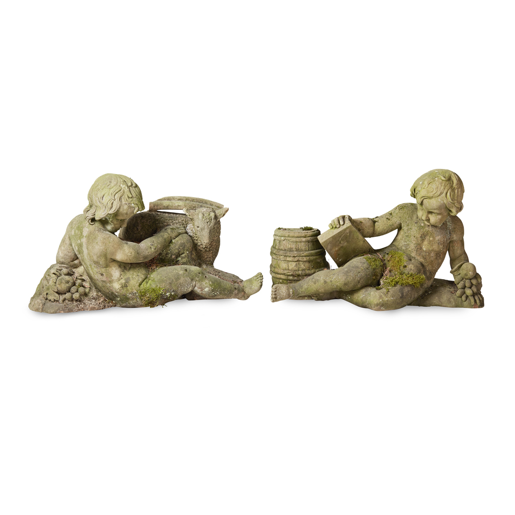 A PAIR OF SCOTTISH SCHOOL CARVED SANDSTONE FIGURES