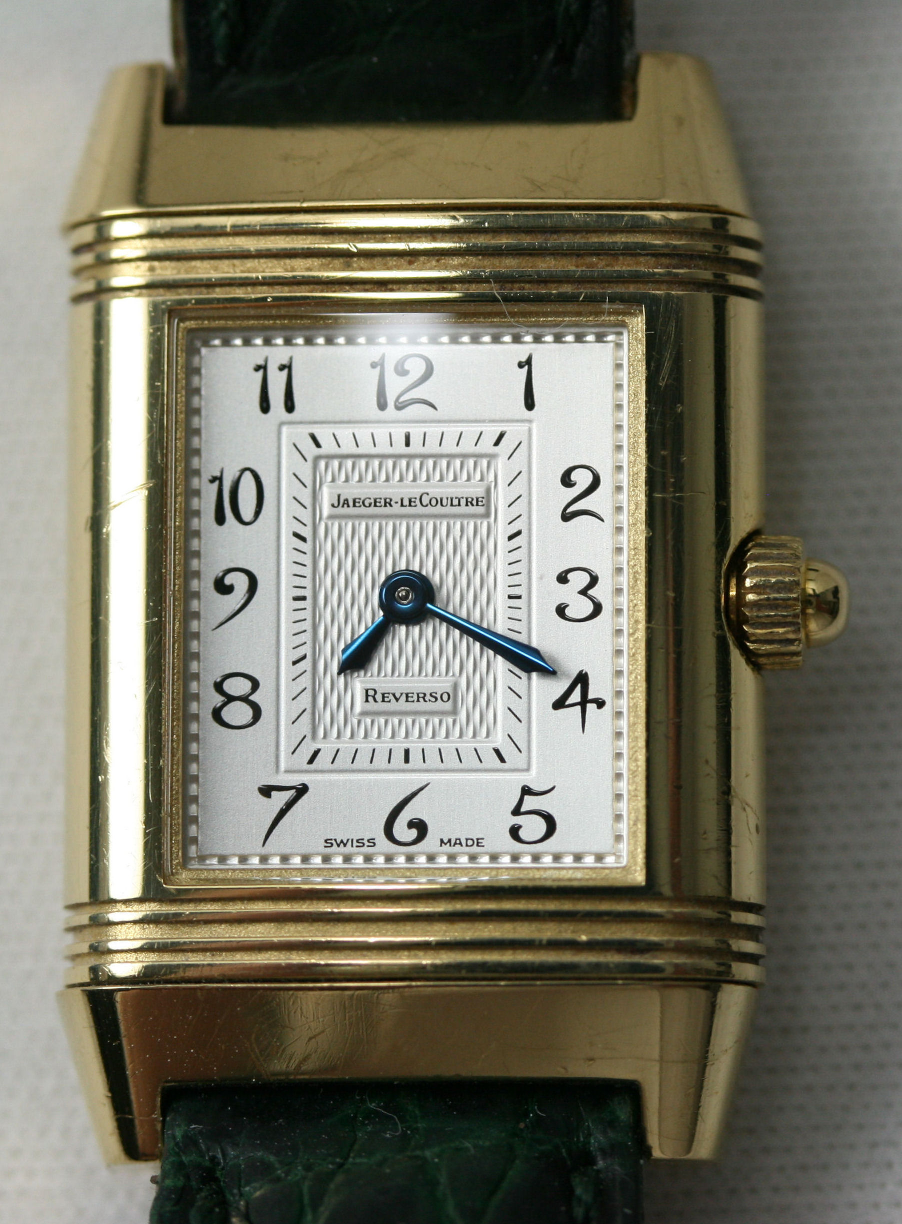 JAEGER-LE COULTRE - a lady's 18ct gold diamond set Reverso wrist watch