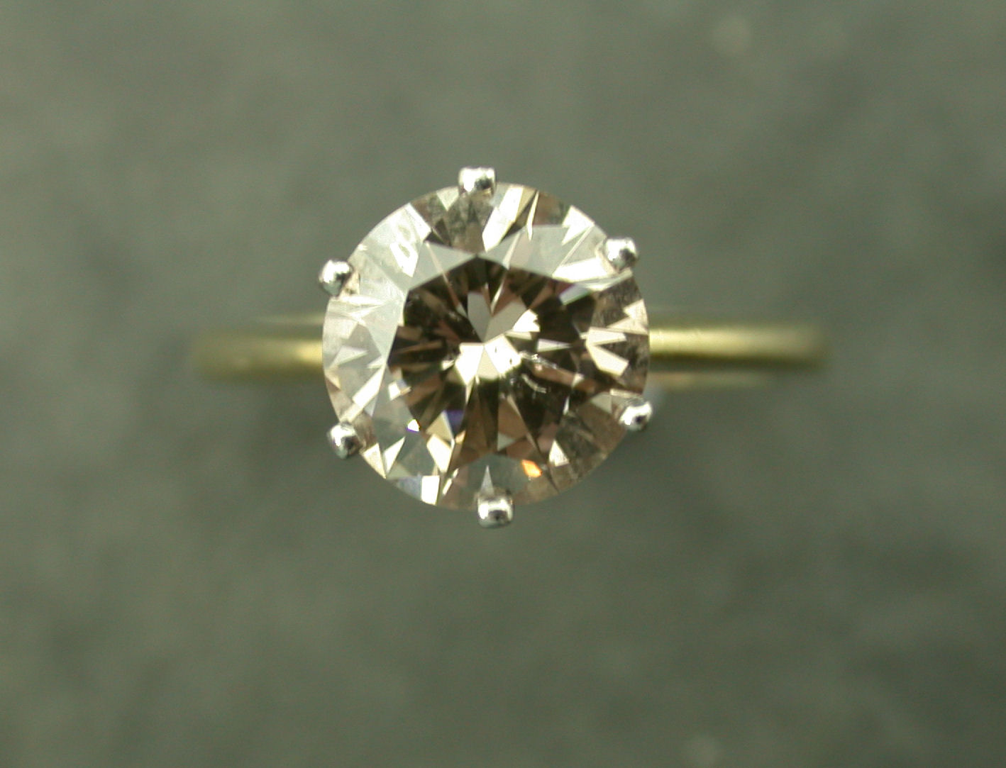 An 18ct gold mounted cinnamon diamond single stone ring,