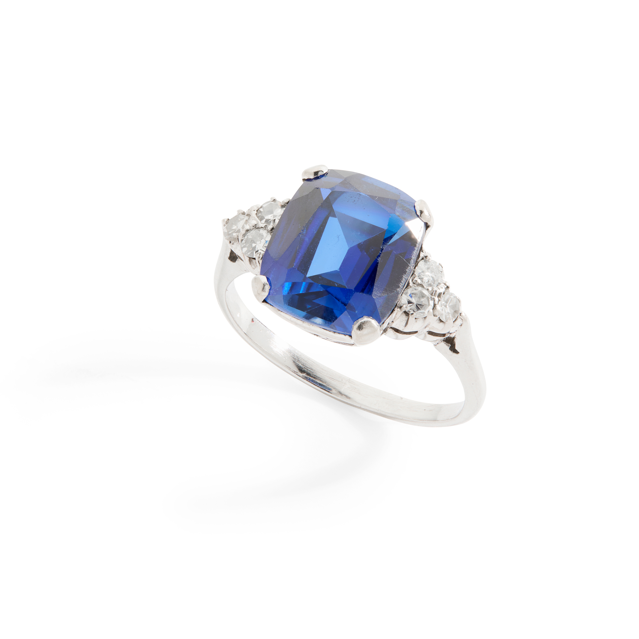 A synthetic sapphire and diamond ring