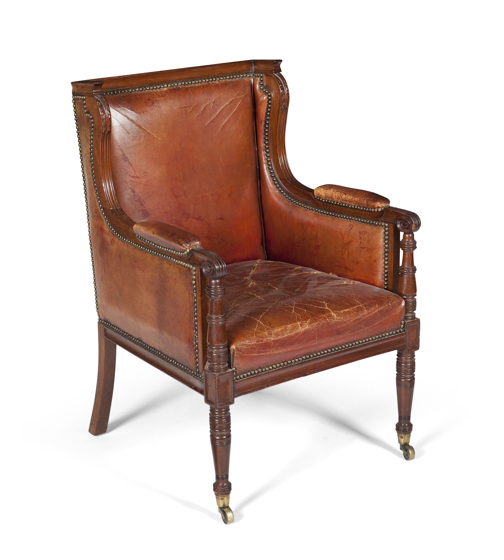 REGENCY STYLE MAHOGANY FRAMED AND LEATHER UPHOLSTERED WING ARMCHAIR
