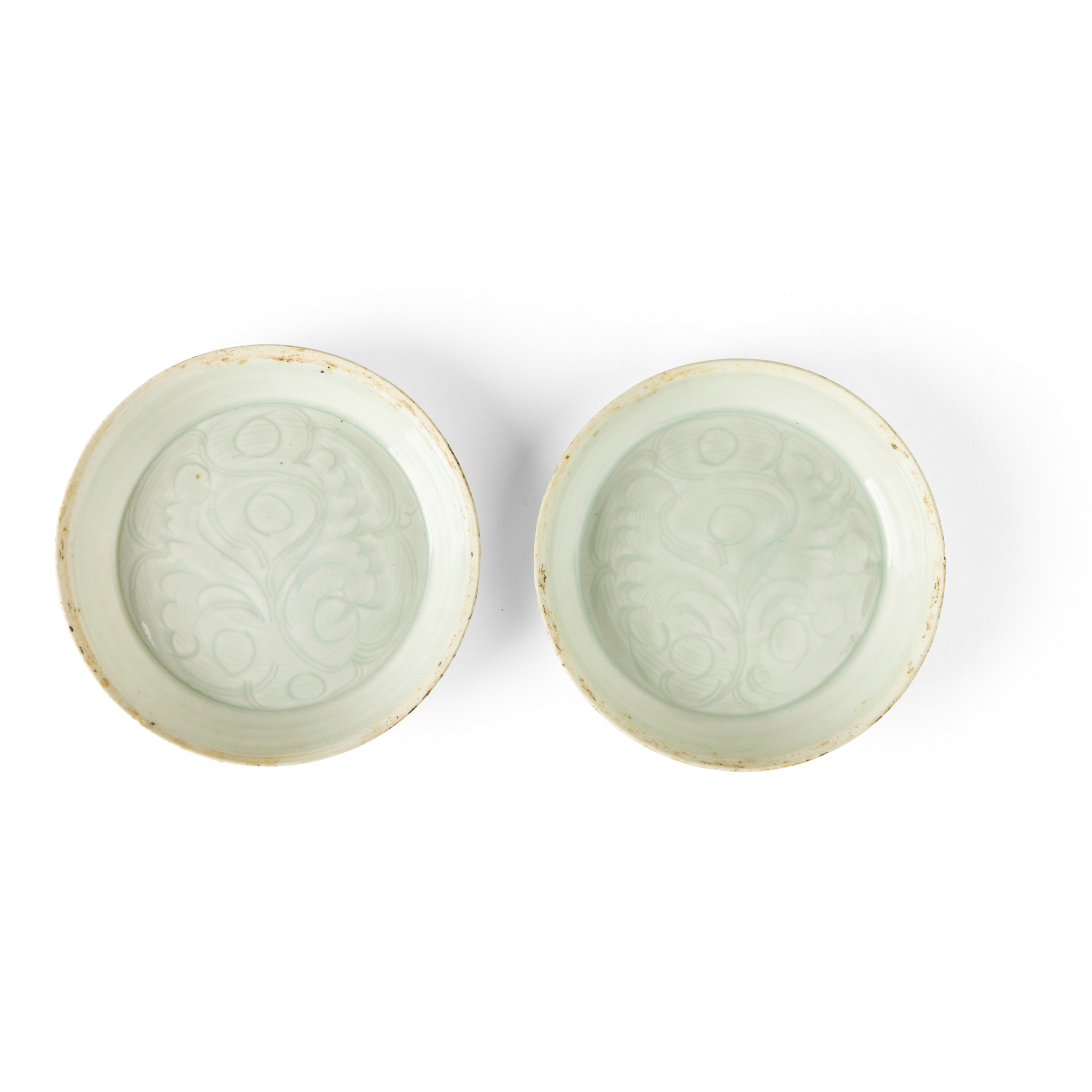 TWO CARVED QINGBAI 'FLORAL' DISHES