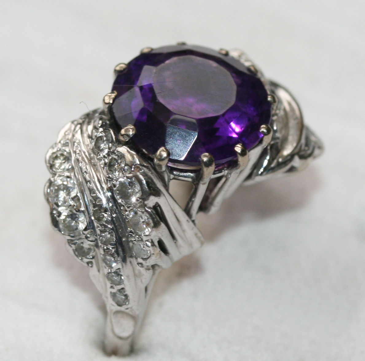 An amethyst and diamond set ring