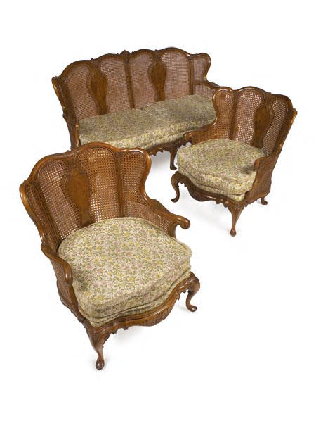 A 1920's walnut double caned bergere suite,