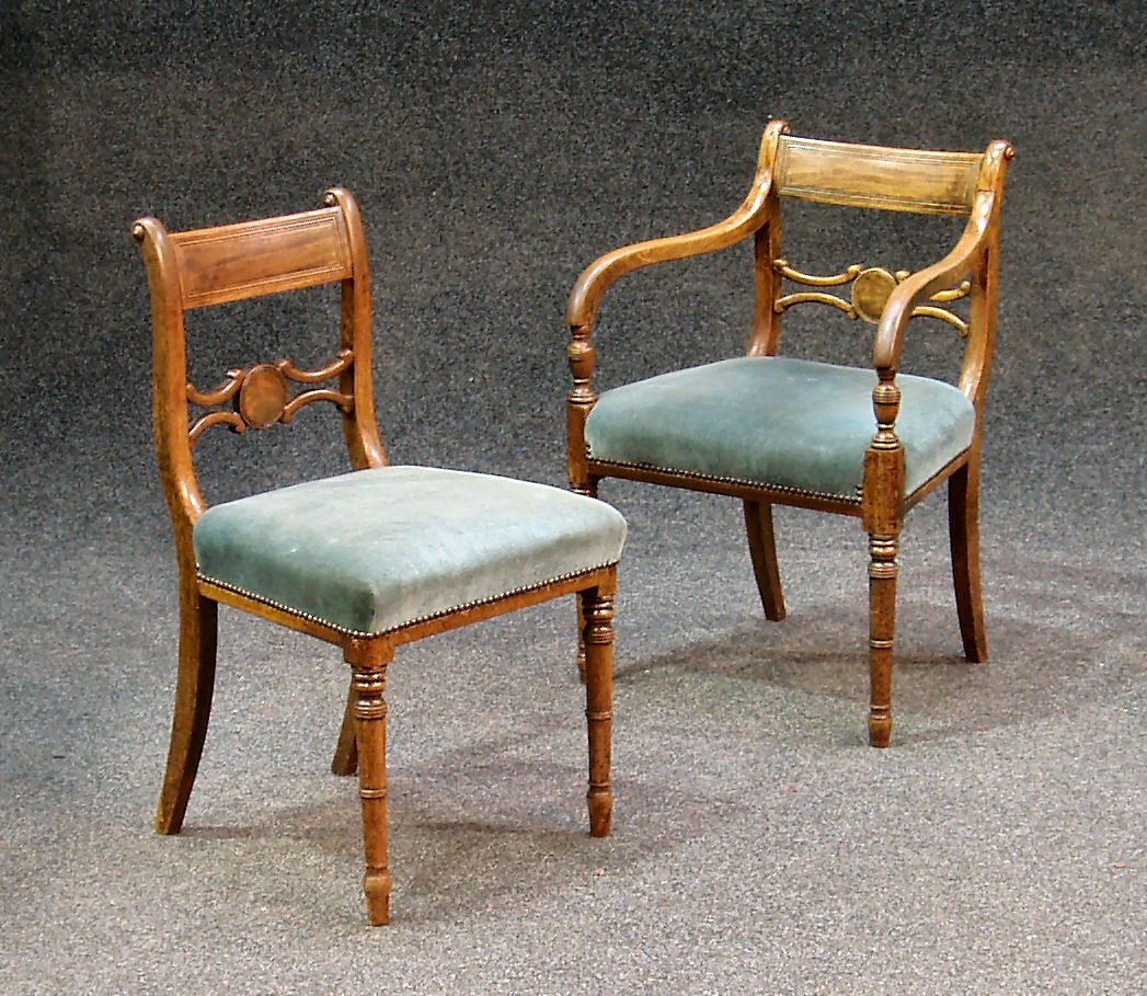 A set of seven mahogany Regency dining chairs