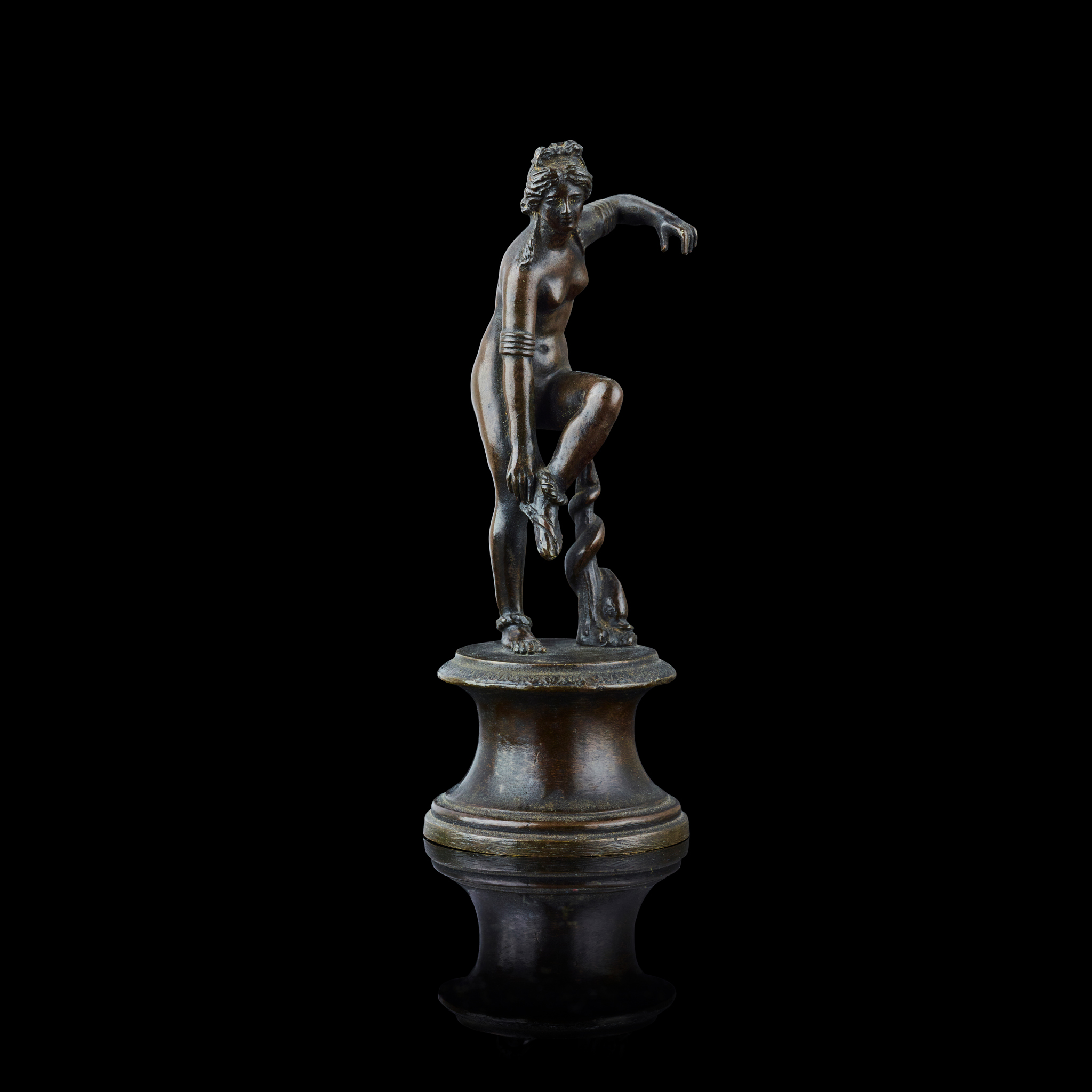 TWO ITALIAN BRONZE FIGURES OF VENUS REMOVING HER SANDAL, AFTER THE ANTIQUE