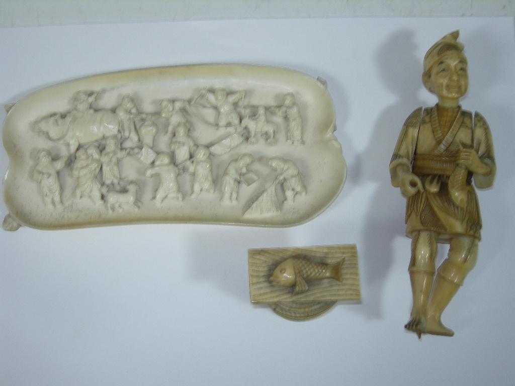A carved ivory panel
