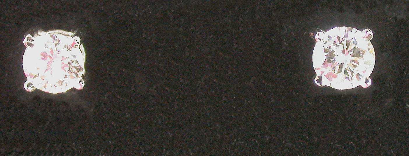 A pair of 18ct white gold mounted diamond earrings,