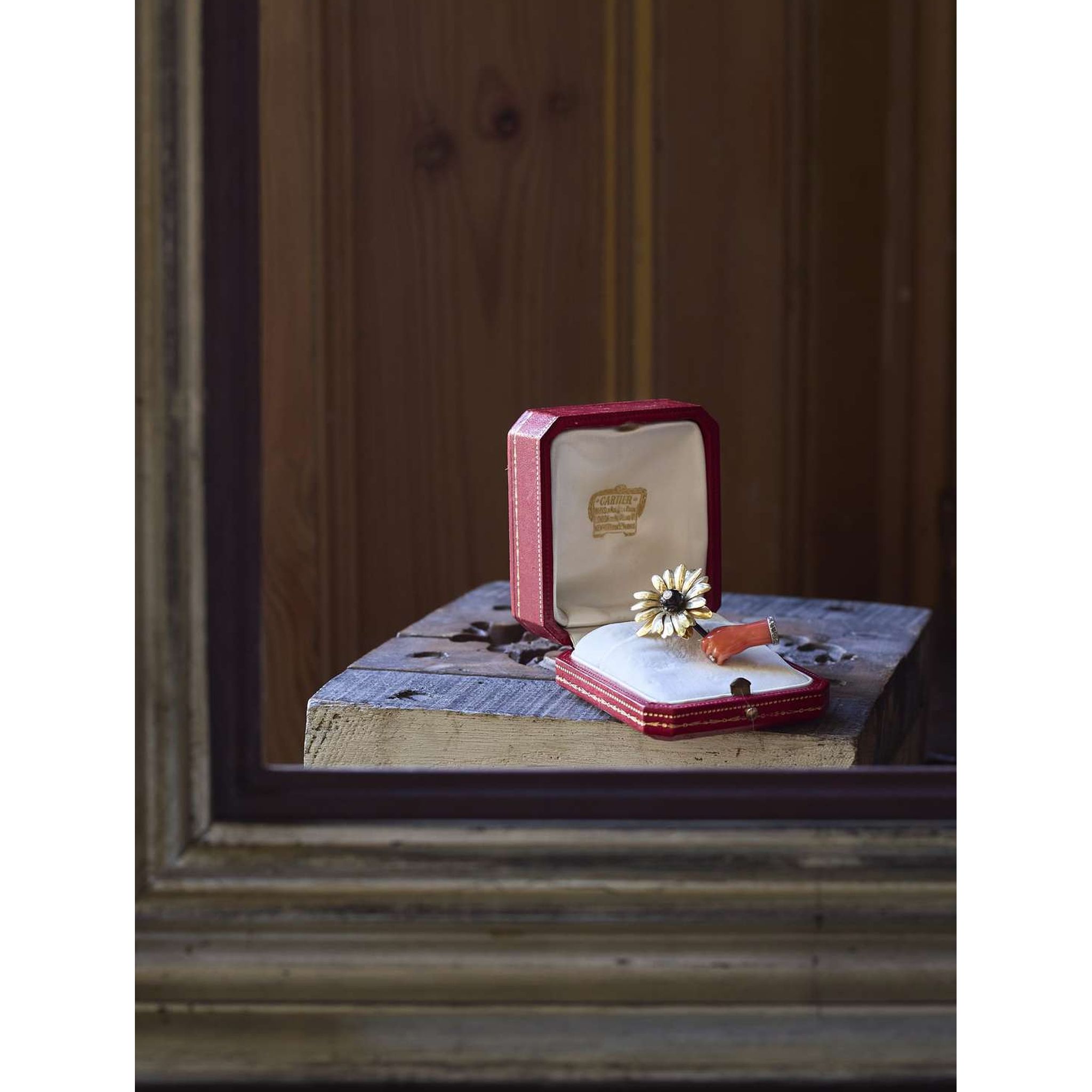 Cartier: A coral and diamond flower brooch