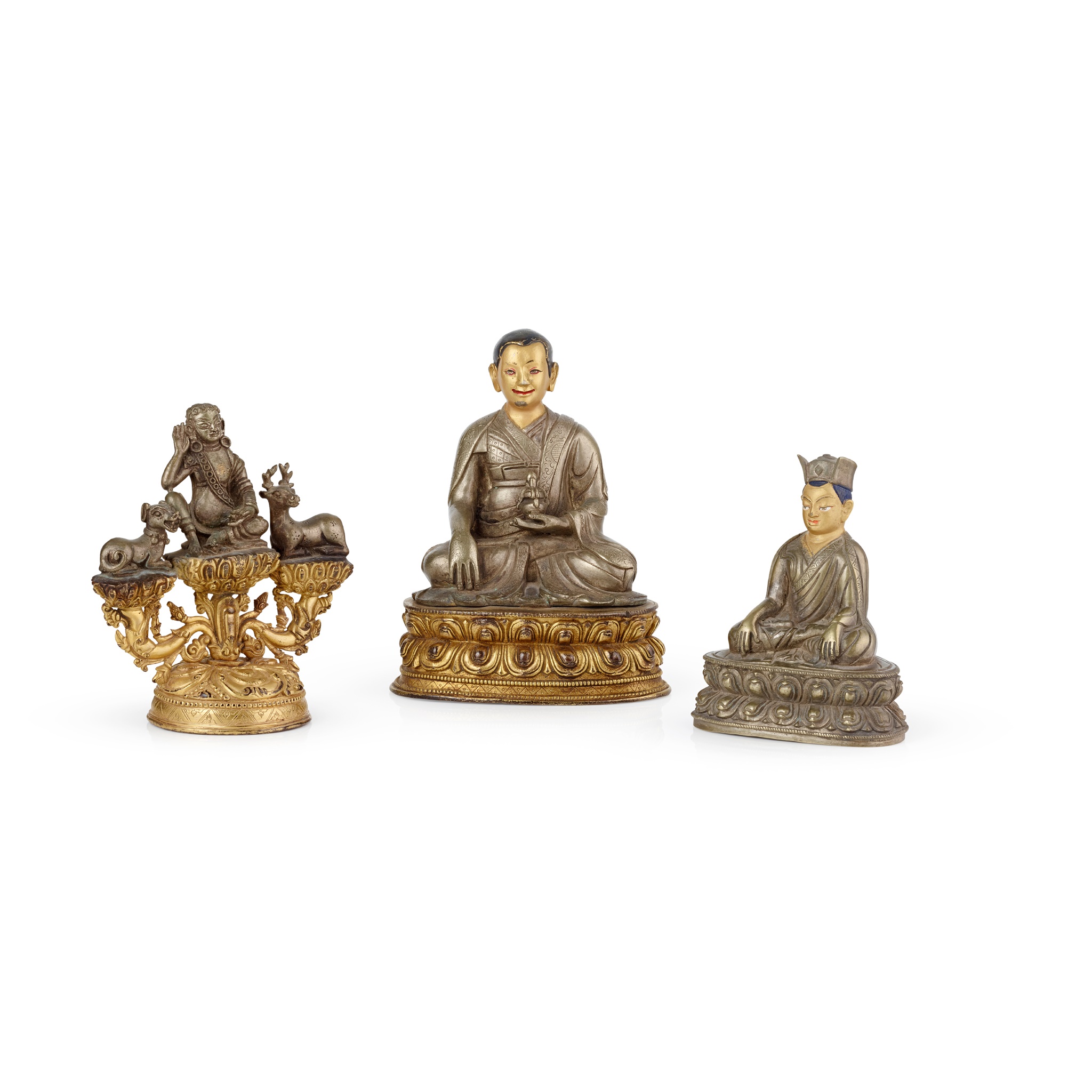 GROUP OF THREE SILVER AND GILT COPPER ALLOY FIGURES OF BUDDHIST MASTERS