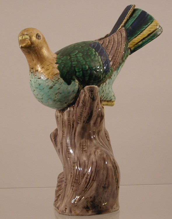 A Chinese export porcelain figure of a turtle dove on rustic plinth