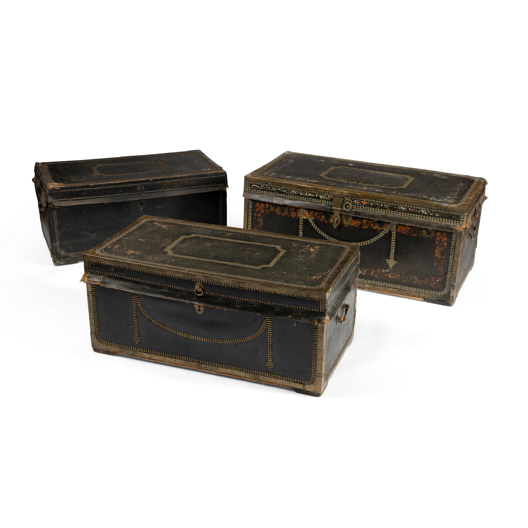 A COLLECTION OF FOUR LEATHER AND BRASS MOUNTED TRUNKS