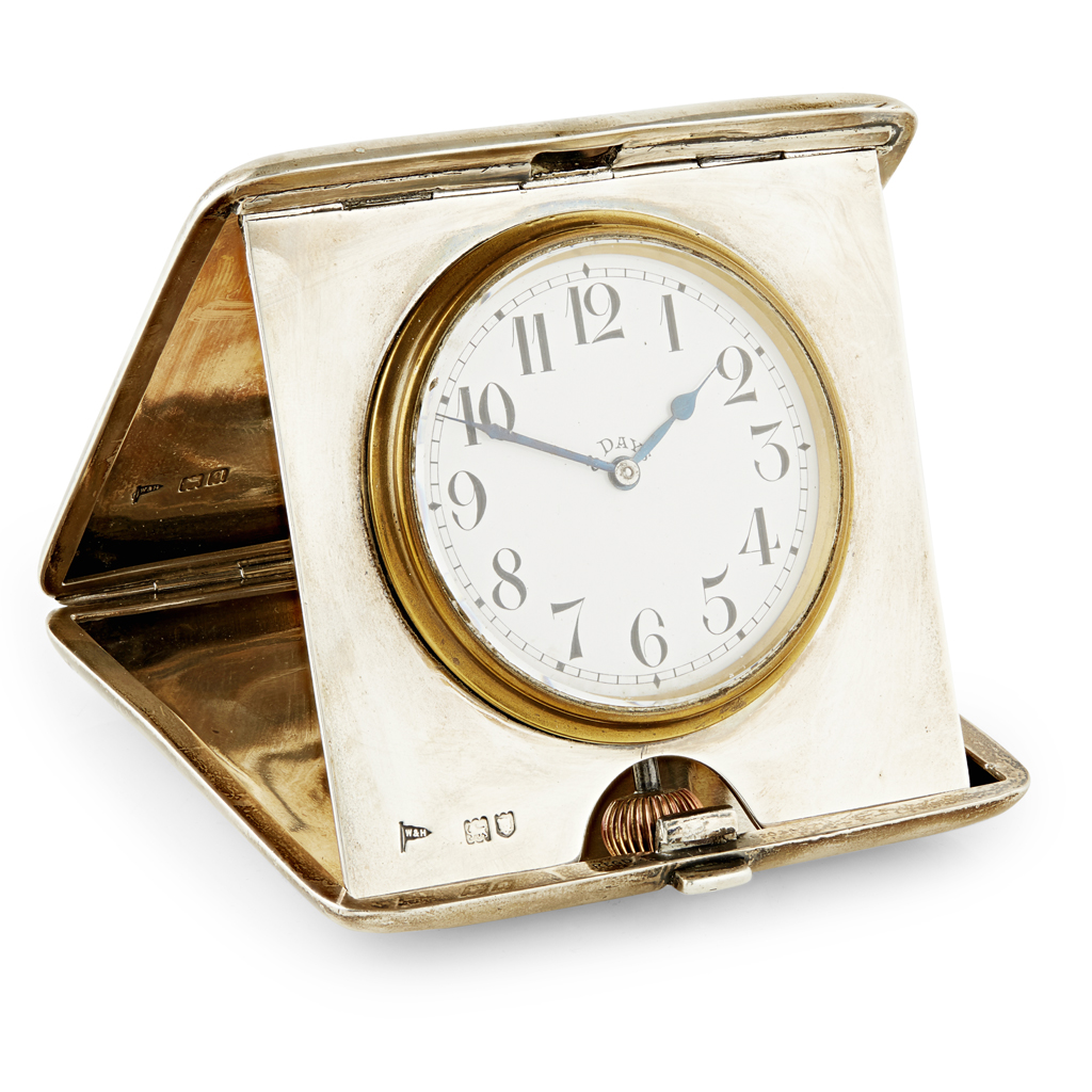 A silver cased travelling clock