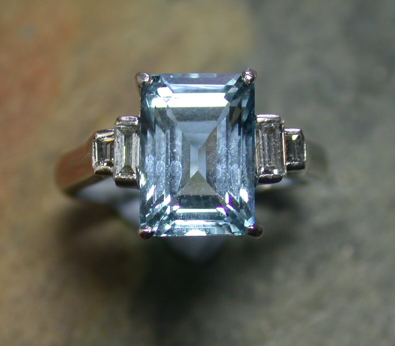 An aquamarine and diamond ring,
