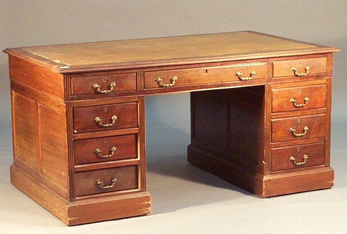 A mahogany twin pedestal desk